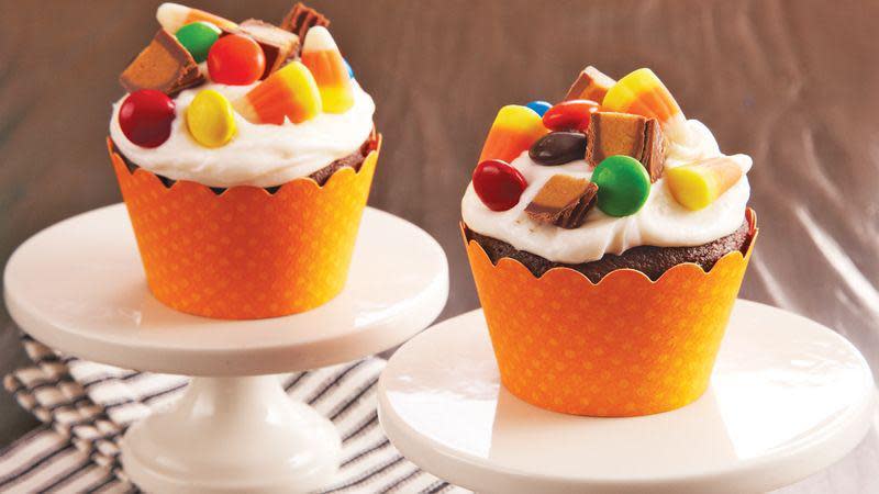 <p>Eating Halloween candies by themselves is great, but add them on top of a cupcake and you’ve got yourself a one-way ticket to a sugar rush. This recipe takes some of the best candies you get after <a href="https://www.thedailymeal.com/holidays/trick-or-treat-coronavirus?referrer=yahoo&category=beauty_food&include_utm=1&utm_medium=referral&utm_source=yahoo&utm_campaign=feed" rel="nofollow noopener" target="_blank" data-ylk="slk:trick-or-treating;elm:context_link;itc:0;sec:content-canvas" class="link ">trick-or-treating</a> and uses them as garnishes on the cupcake.</p> <p><a href="https://www.thedailymeal.com/recipes/halloween-candy-cupcakes-recipe?referrer=yahoo&category=beauty_food&include_utm=1&utm_medium=referral&utm_source=yahoo&utm_campaign=feed" rel="nofollow noopener" target="_blank" data-ylk="slk:For the Halloween Candy Cupcakes recipe, click here.;elm:context_link;itc:0;sec:content-canvas" class="link ">For the Halloween Candy Cupcakes recipe, click here.</a></p>