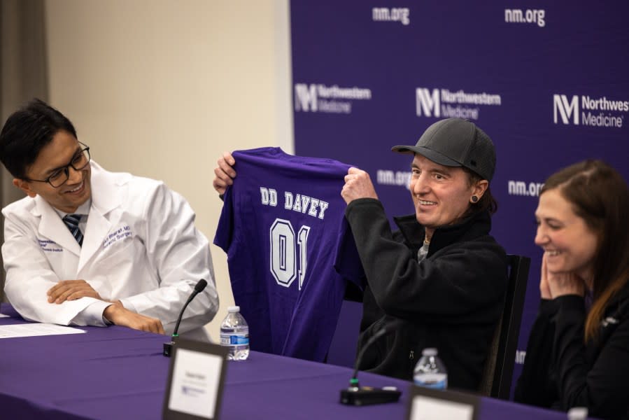 David Bauer holds up his “DD Davey” during a press conference. (Photo courtesy of Northwestern Medicine)