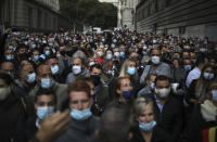 Angry restaurant and bar owners demonstrate in Marseille, southern France, Friday Sept. 25, 2020 to challenge a French government order to close all public venues as of Saturday to battle resurgent virus infections. The protesters, and local officials in France's second-biggest city, are also threatening legal action, to try to block the order via the courts. They argue that Marseille's virus case rise has been stabilizing, and that the central government in Paris is unfairly singling out Marseille for the toughest virus measures in the nation. (AP Photo/Daniel Cole)