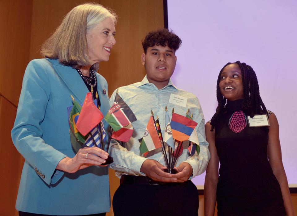 After U.S. Rep. Katherine Clark announced a $600,000 expansion of the MetroWest Scholars Early Start program at Framingham State University, Waltham students Elian Gonzalez and Melody Obi-Ngo presented her with flags as a gift.