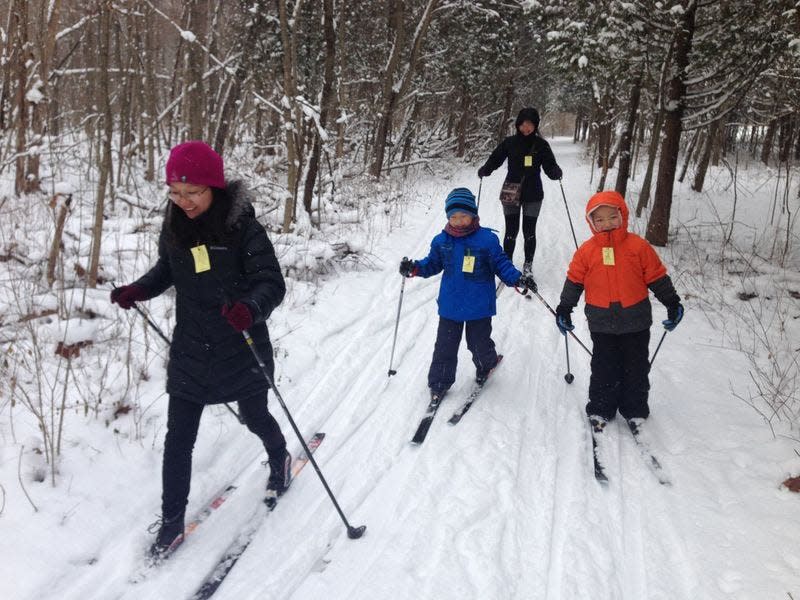 A family skis in a recent winter at St. Patrick’s County Park in South Bend. Tribune Photo/JOSEPH DITS