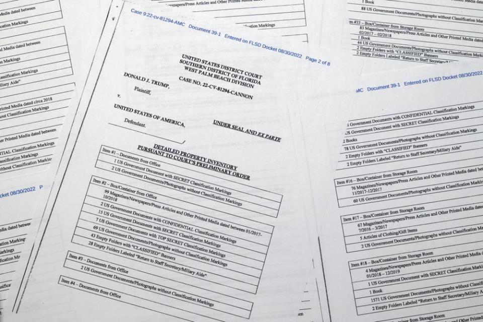 Pages from a FBI property list of items seized from former President Donald Trump’s Mar-a-Lago estate and made public by the Department of Justice, are photographed Friday, Sept. 2, 2022. FBI agents who searched the home found empty folders marked with classified banners. The inventory reveals in general terms the contents of the 33 boxes taken during the Aug. 8 search. (AP Photo/Jon Elswick)