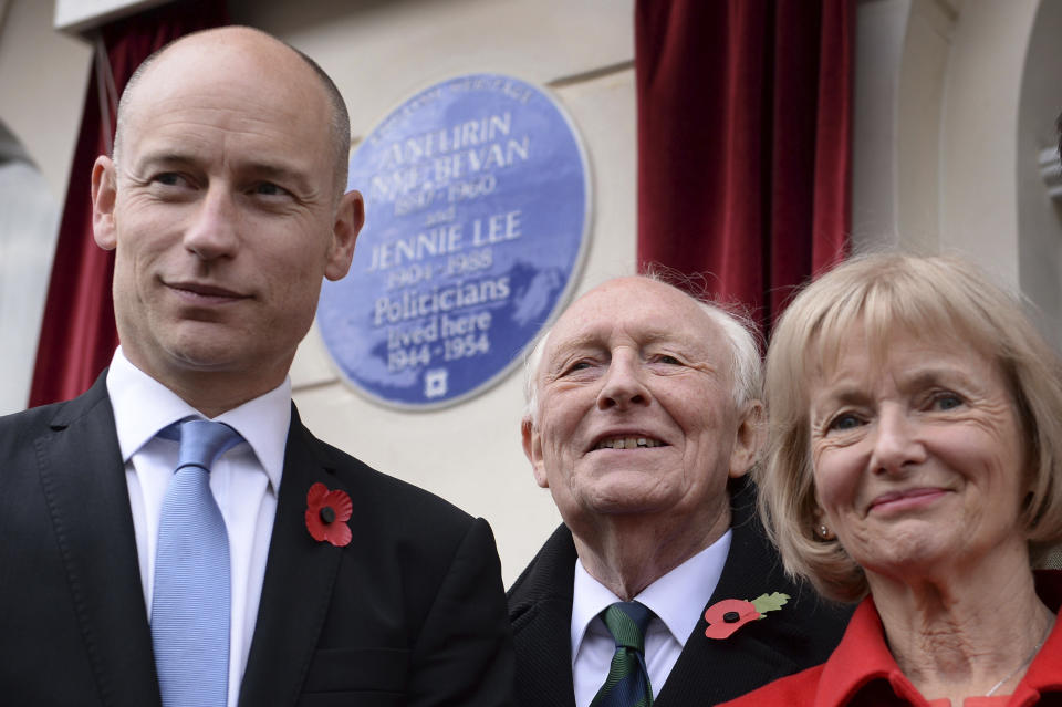 FILE - Former Labour leader Neil Kinnock, his wife Glenys and son Stephen Kinnock MP pose for a photo after he unveiled an English Heritage blue plaque at 23 Cliveden Place in Chelsea, London, Nov. 3, 2015. Glenys Kinnock, a former British cabinet minister, member of the European Parliament and wife of former Labour leader Neil Kinnock, has died. Her family says Kinnock, 79, died Sunday, Dec. 3, 2023 at her London home some six years after being diagnosed with Alzheimer’s. She was remembered as being an outspoken leader who advocated for reducing poverty and starvation. (Stefan Rousseau/PA via AP, File)