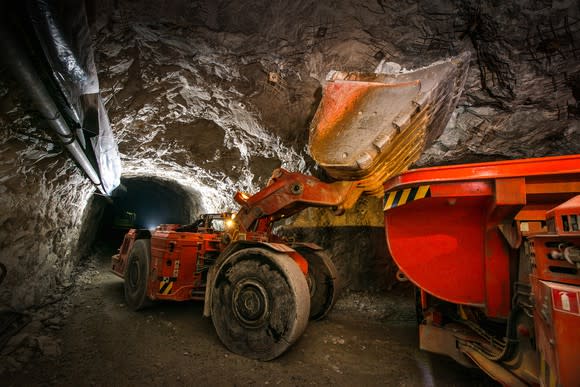 An excavator working in an underground precious-metal mine.