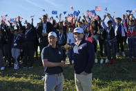 European Captain Luke Donald, left, and United States Captain Zach Johnson pose with the Ryder Cup trophy before an exhibition match on the occasion of The Year to Go event at the Marco Simone course that will host the 2023 Ryder Cup, in Guidonia Montecelio, near Rome, Italy, Monday, Oct. 3, 2022. (AP Photo/Alessandra Tarantino)