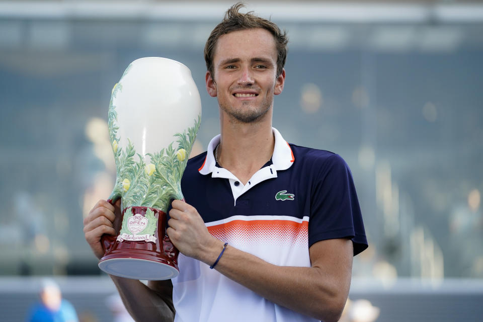 Daniil Medvedev, of Russia, holds the Rookwood Cup after defeating David Goffin, of Belgium, in the men's final match during the Western & Southern Open tennis tournament Sunday, Aug. 18, 2019, in Mason, Ohio. (AP Photo/John Minchillo)