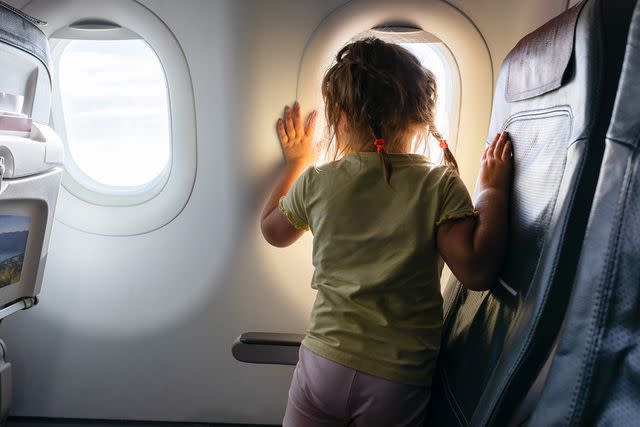 <p>Getty</p> Stock photo of a toddler on a plane