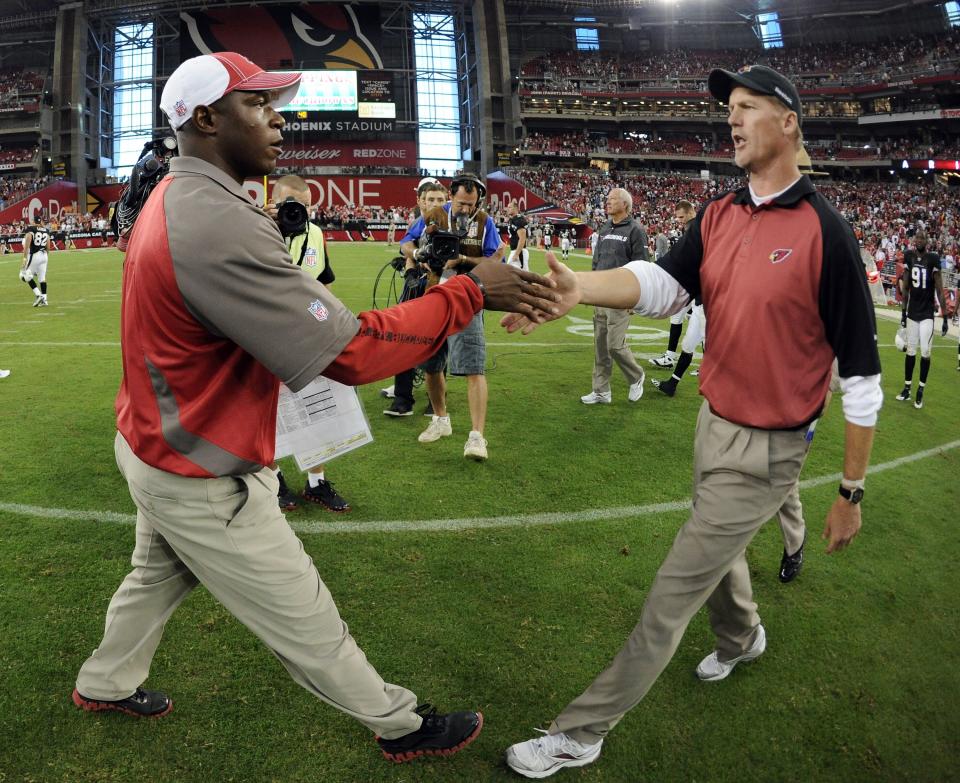 GLENDALE, AZ - OCTOBER 31:  Head Coach of the Tampa Bay Buccaneers Raheem Morris (L) is congratulated by Head Coach of the Arizona Cardinals Ken Whisenhunt after a 38-35 win at University of Phoenix Stadium on October 31, 2010 in Glendale, Arizona.  (Photo by Harry How/Getty Images)