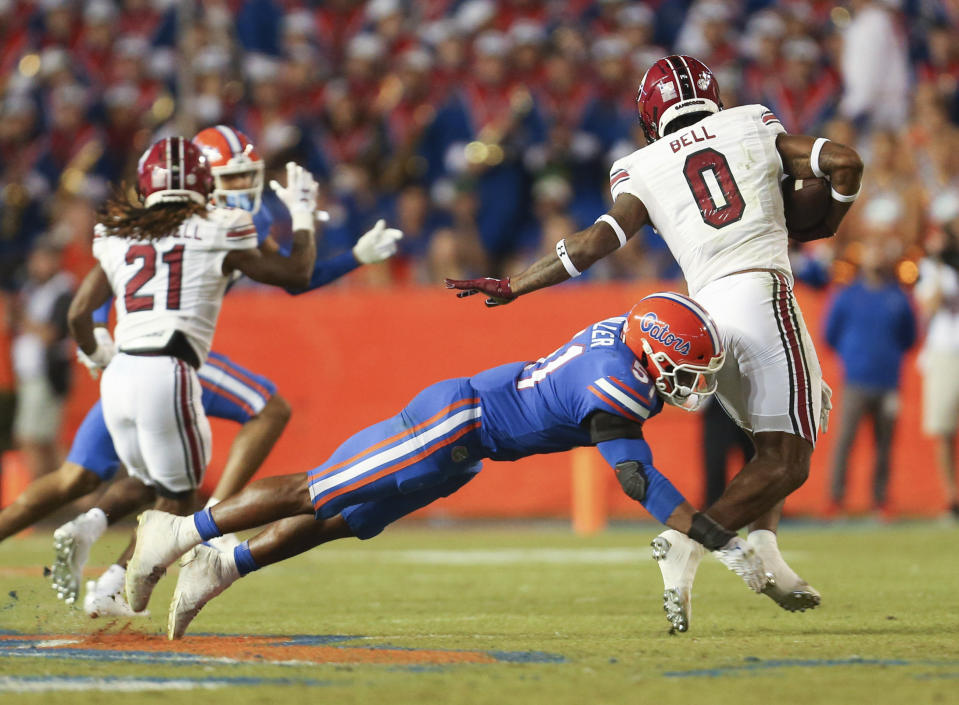 Florida linebacker Ventrell Miller (51) tackles South Carolina tight end Jaheim Bell (0) for a loss during the second half of an NCAA college football game, Saturday, Nov. 12, 2022, in Gainesville, Fla. (AP Photo/Matt Stamey)