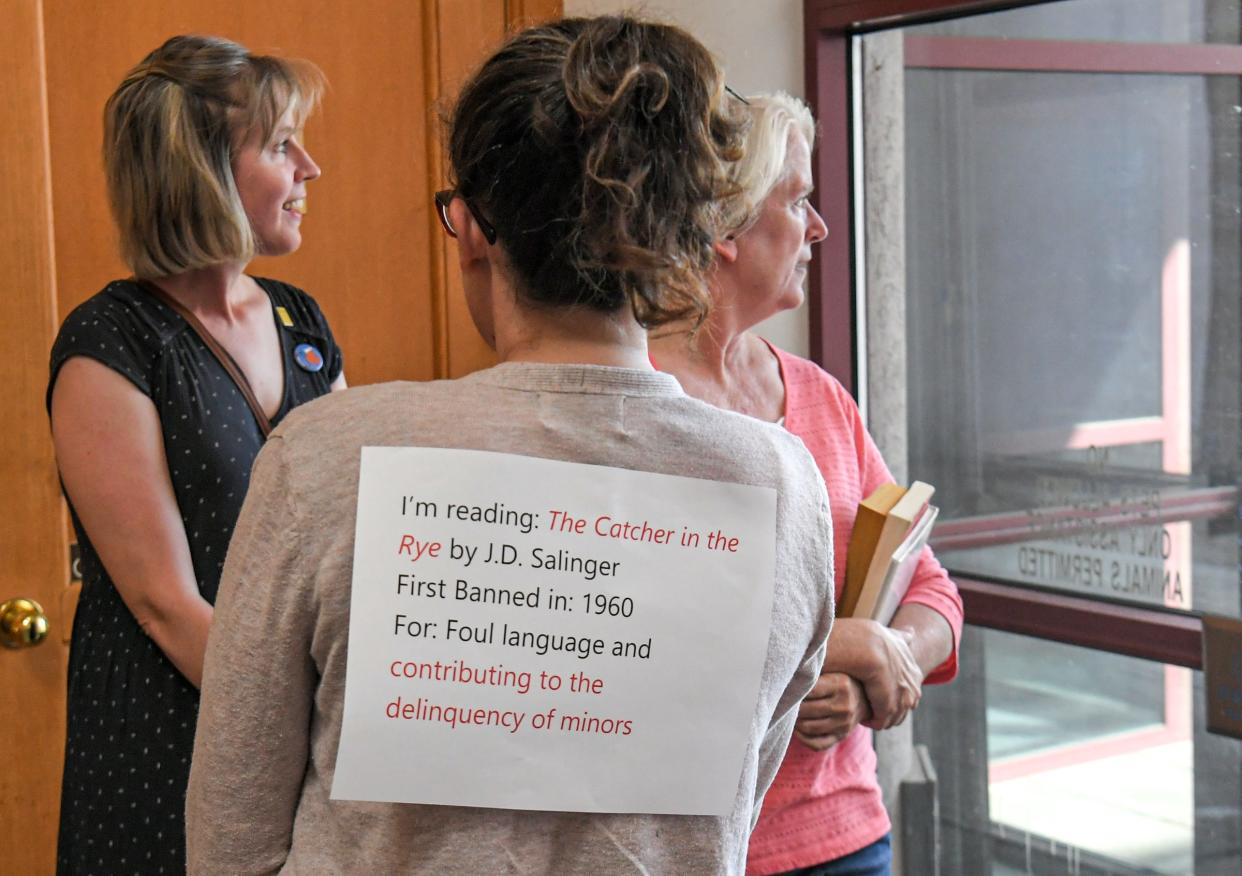 Daneen Schatzle of Greenville, middle, Amy Pecht, right, and Mary Frances Schelato, left, wait to attend the Greenville County Council Citizen Comment Session in Greenville, SC Thursday, September 22, 2022. LGBTQ advocates spoke out against a rumored upcoming LGBTQ children's book ban. 