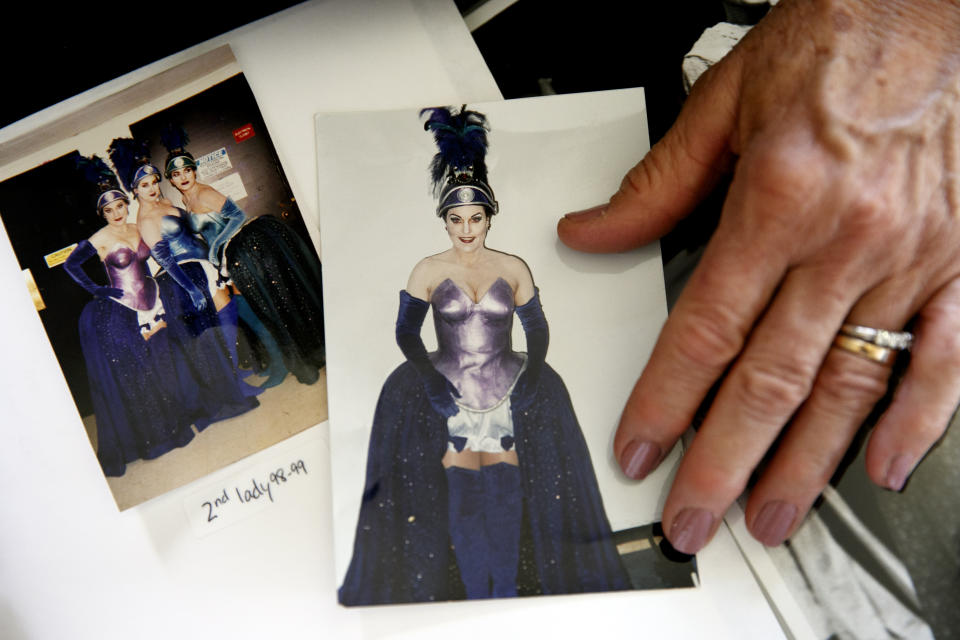 Photos of retired opera singer Patricia Wulf shows photos of herself at right and also at far left in the photo at left, in costume for her role in "The Magic Flute" in 1998 at the Washington Opera, at her home in rural northern Virginia, on Friday, July 12, 2019. Wulf is one of nine women who have told The Associated Press that they were sexually harassed by Domingo, one of the most celebrated and powerful men in opera, in encounters that took place over three decades, at venues that included Washington Opera, where he held top administrative positions. (AP Photo/Jacquelyn Martin)