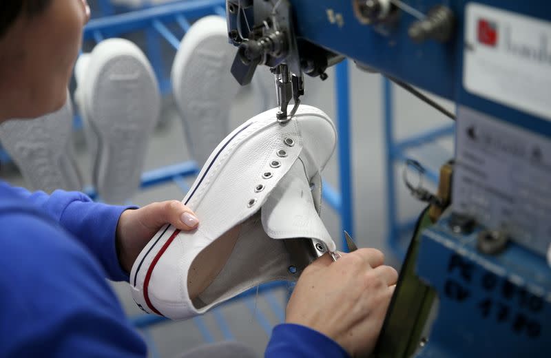 A worker makes a shoe at the footwear factory 'Dermal' in Kotor Varos