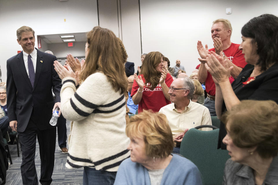 Supporters of Republican Assemblyman Jay Webber cheer as he arrives for a candidate forum at the UJC of MetroWest New Jersey, Tuesday, Oct. 9, 2018, in Whippany, N.J. (AP Photo/Mary Altaffer)