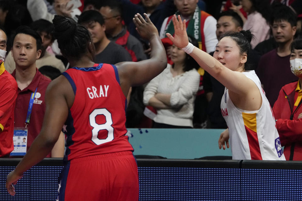 China's Wu Tongtong reacts with United States' Chelsea Gray following their gold medal game at the women's Basketball World Cup in Sydney, Australia, Saturday, Oct. 1, 2022. (AP Photo/Mark Baker)