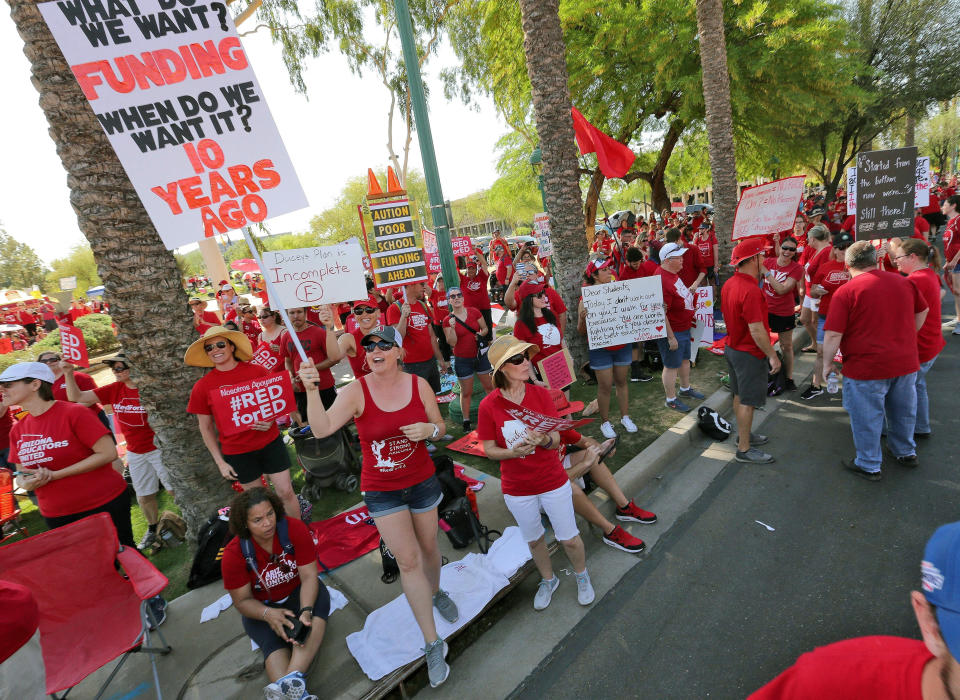 On April 27, 2018, teachers rally outside the Capitol in Phoenix, in a series of strikes across the nation over low teacher pay. (Photo: AP Photo/Matt York)