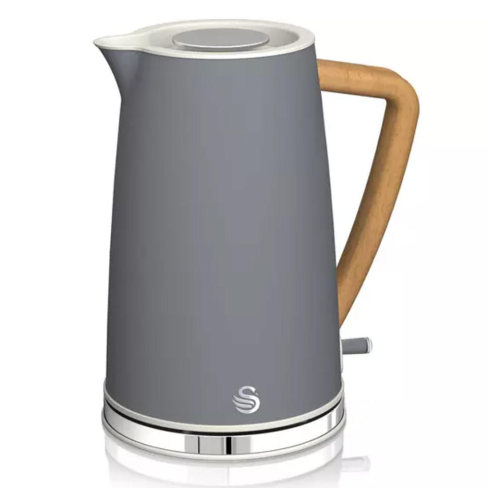 Grey kettle with a wooden handle