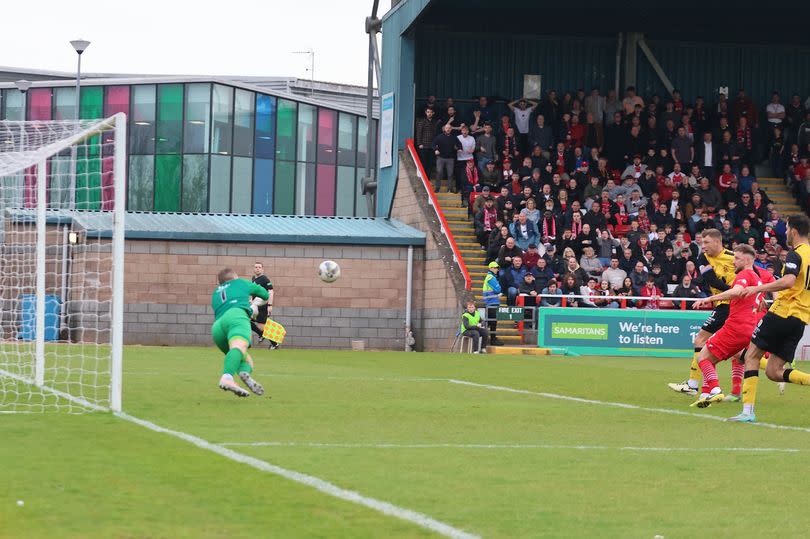 Annan keeper Greg Fleming pushes away Ross McGeachie's second half header