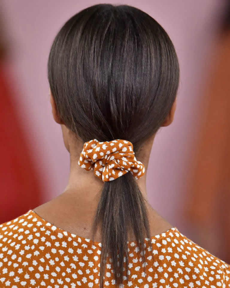 <p>Did someone say 90s? Yup, scrunchies are officially back thanks to Mansur Gavriel. Use the throwback hair tie to secure loose ponytails for a look that says understated rather than retro.</p><p>'To keep it looking modern, avoid having a massive scrunchie,' says backstage hairstylist Adam Reed. 'Go for a style that's simple like a really smooth, really sleek, low pony and secure it with a scrunchie. Keep the colour plain - nothing patterned or metallic!<span>'</span></p>