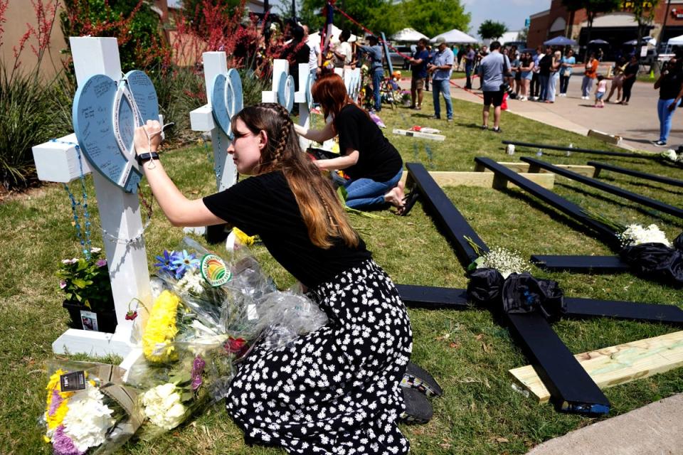 Mourners set up a memorial for victims of the Allen outlet mall shooting in Texas (Copyright 2023 The Associated Press. All rights reserved.)