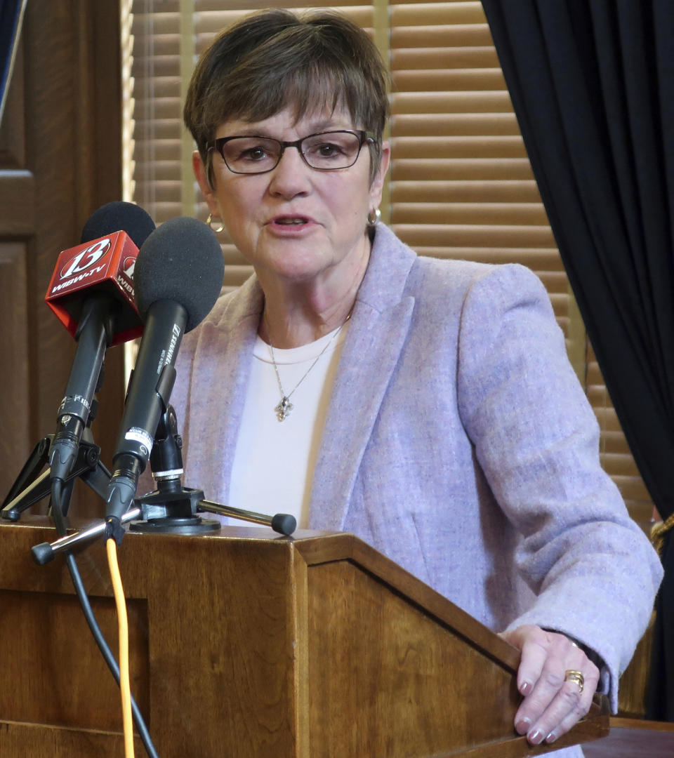 FILE - In this Thursday, March 7, 2019 file photo, Kansas Gov. Laura Kelly answers questions during a news conference at the Statehouse in Topeka, Kansas. The Democratic governor has vetoed a tax relief bill approved by the Republican-controlled Legislature, saying that it would return her red state to a nationally infamous fiscal experiment under her GOP predecessors. The bill was aimed at preventing individuals and businesses from paying more in state income taxes because of changes in federal tax laws at the end of 2017. (AP Photo/John Hanna, File)