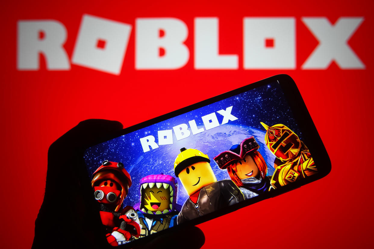 UKRAINE - 2021/10/05: In this photo illustration a Roblox logo of an online game platform is seen on a smartphone and a pc screen. (Photo Illustration by Pavlo Gonchar/SOPA Images/LightRocket via Getty Images)