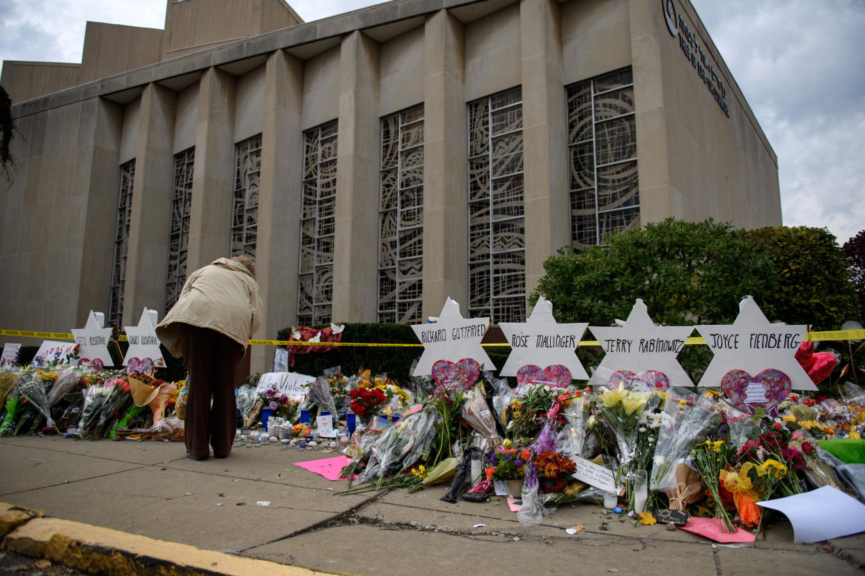 Mourners visit the memorial outside the Tree of Life Synagogue on Oct. 31, 2018, in Pittsburgh. Eleven people were killed in a shooting there on Oct. 27. (Photo: Jeff Swensen via Getty Images)