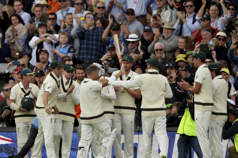 Australia's David Warner celebrates his record 335 not out during their cricket test match against Pakistan in Adelaide, Saturday, Nov. 30, 2019. (AP Photo/James Elsby)