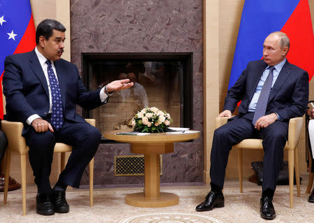 FILE PHOTO: Russian President Vladimir Putin (R) meets with his Venezuelan counterpart Nicolas Maduro at the Novo-Ogaryovo state residence outside Moscow, Russia December 5, 2018. REUTERS/Maxim Shemetov/File Photo