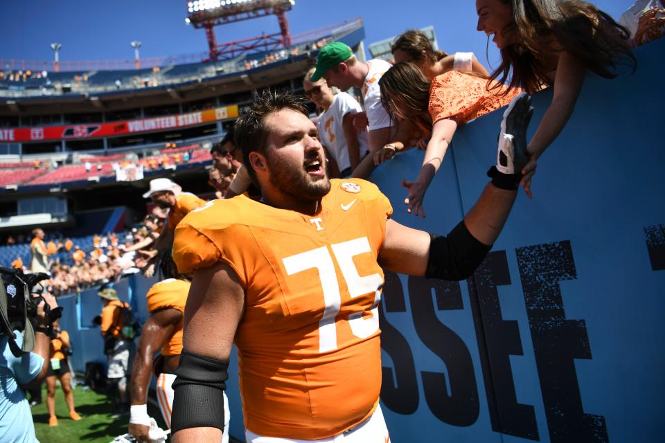 Tennessee offensive lineman Jackson Lampley (75) greets fans after a game between Tennessee and Virginia in Nissan Stadium in Nashville, Tenn., Saturday, Sept. 2, 2023. Tennessee defeated Virginia 49-13.