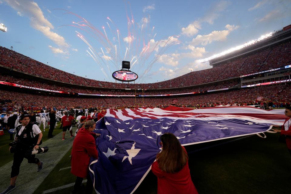 Week 1: An American flag is unfurled before the start of the NFL Kickoff Game at Arrowhead Stadium.
