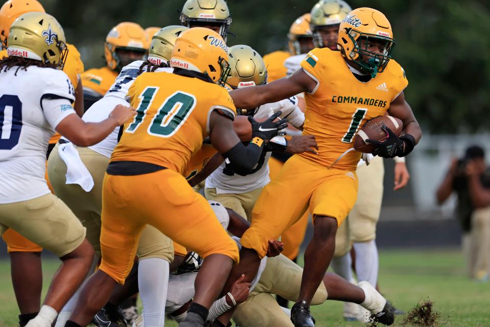 Ed White's Tony Williams rushes for a two-point conversion. The Commanders take on Ribault on Friday.