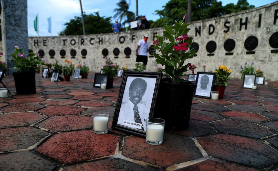 A small group of protesters honor all victims of police brutality during a protest called “Say Their Names” at the Friendship Torch on Biscayne Boulevard in Miami on Saturday July 4.