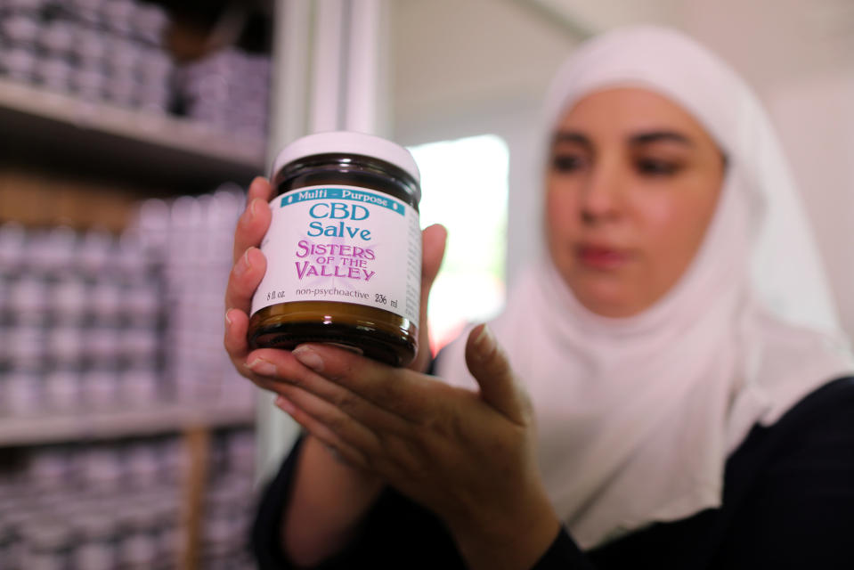 California "weed nun" Desiree Calderon, who goes by the name Sister Freya, holds CBD salve made from hemp at Sisters of the Valley near Merced, California, U.S., April 18, 2017. Picture taken April 18, 2017. REUTERS/Lucy Nicholson