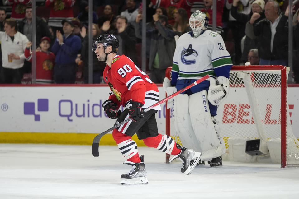 Chicago Blackhawks center Tyler Johnson skates to the bench after scoring on Vancouver Canucks goaltender Thatcher Demko during the second period of an NHL hockey game, Tuesday, Feb. 13, 2024, in Chicago. (AP Photo/Erin Hooley)