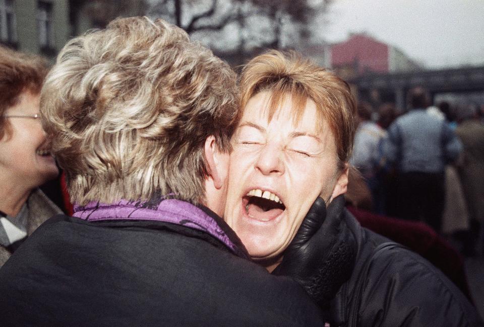 East German Rosemarie Doln is overwhelmed with emotion as she is welcomed by an unidentified relative at the opening of the wall passage at Wollankstrasse in West Berlin's district of Wedding on Nov. 13, 1989 in Berlin.