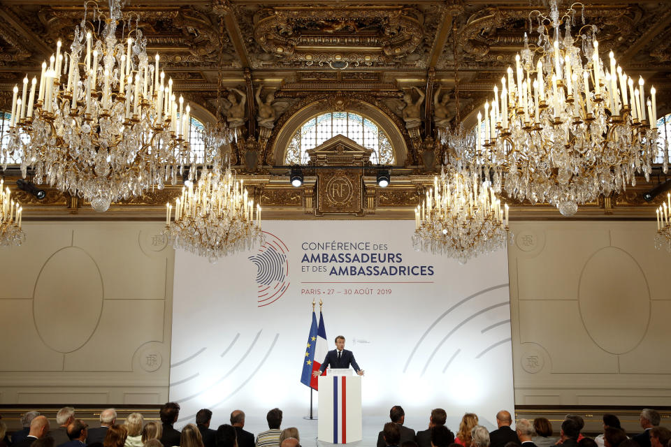 French President Emmanuel Macron delivers a speech during the annual French ambassadors conference at the Elysee Palace in Paris, Tuesday, Aug. 27 2019. French President Emmanuel Macron is calling for a new global economic order, decrying an "unprecedented crisis" in the market economy. (Yoan Valat, Pool via AP)