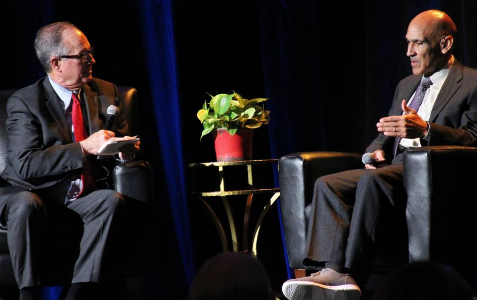 Former longtime TV sports anchor David Bacon, now co-news anchor at KRBC, interviews former NFL coach and current TV football analyst Tony Dungy after Dungy spoke at Monday night's 50th anniversary event for Day Nursery of Abilene.