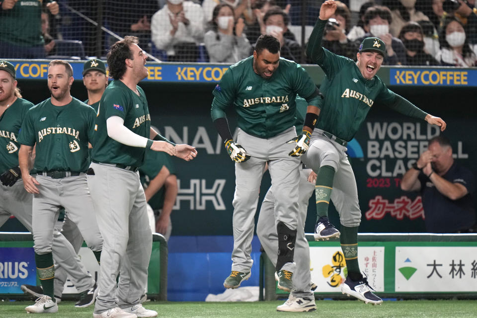 Australian players celebrate after Alex Hall hit a 2-run triple in the 8th inning during their Pool B game at the World Baseball Classic at the Tokyo Dome Monday, March 13, 2023, in Tokyo. (AP Photo/Shuji Kajiyama)