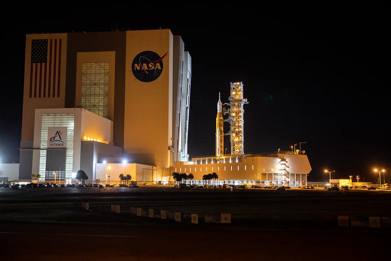 NASA's Space Launch System moon rocket was hauled from the Kennedy Space Center's Vehicle Assembly Building back out to pad 39B early Monday for another attempt to load the huge booster with fuel in a critical dress-rehearsal countdown. / Credit: NASA