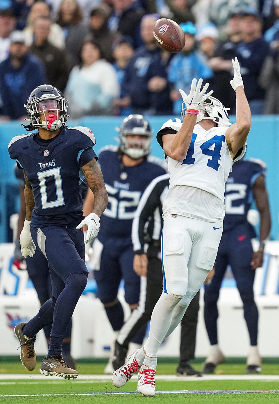 Indianapolis Colts wide receiver Alec Pierce (14) receives a long pass to put the Colts at first and goal in overtime Sunday, Dec. 3, 2023, at Nissan Stadium in Nashville, Tenn. The Colts went on to score to win in overtime, 31-28.