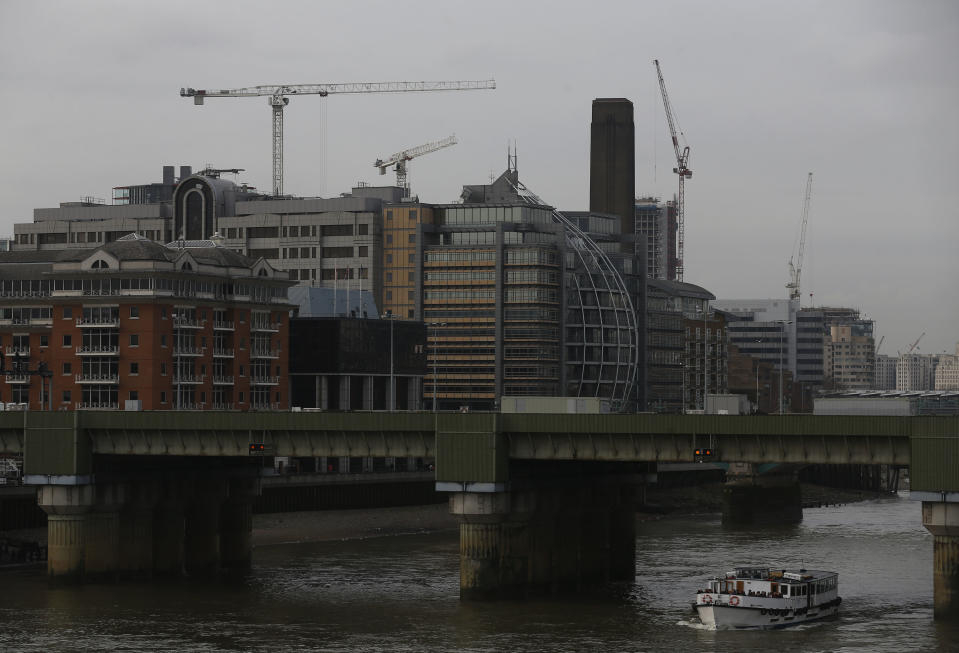 In this photo taken Friday Jan. 24, 2014, construction cranes work on buildings in London. The face of London is about to change. Dozens of buildings of 20 stories or more are slated for construction, many to be clustered along the south bank of the River Thames just down the river from Big Ben and the majestic dome of St. Paul’s Cathedral. (AP Photo/Sang Tan)