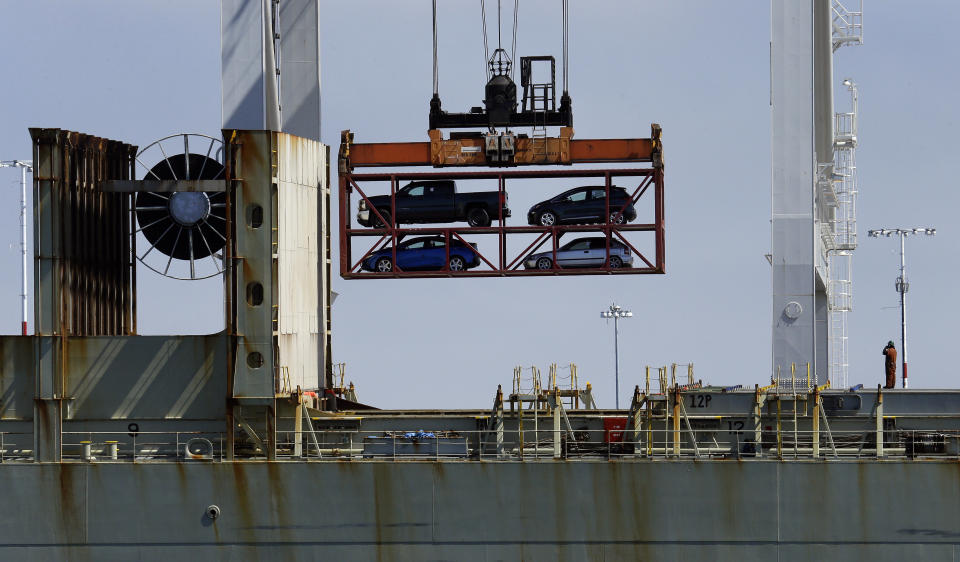 FILE - In this July 13, 2017, file photo, a crane transporting vehicles operates on a container ship at the Port of Oakland, in Oakland, Calif. China on Tuesday, Sept. 18, 2018, announced a tariff hike on $60 billion of U.S. products in response to President Donald Trump's latest duty increase in a dispute over Beijing's technology policy. (AP Photo/Ben Margot, File, File)