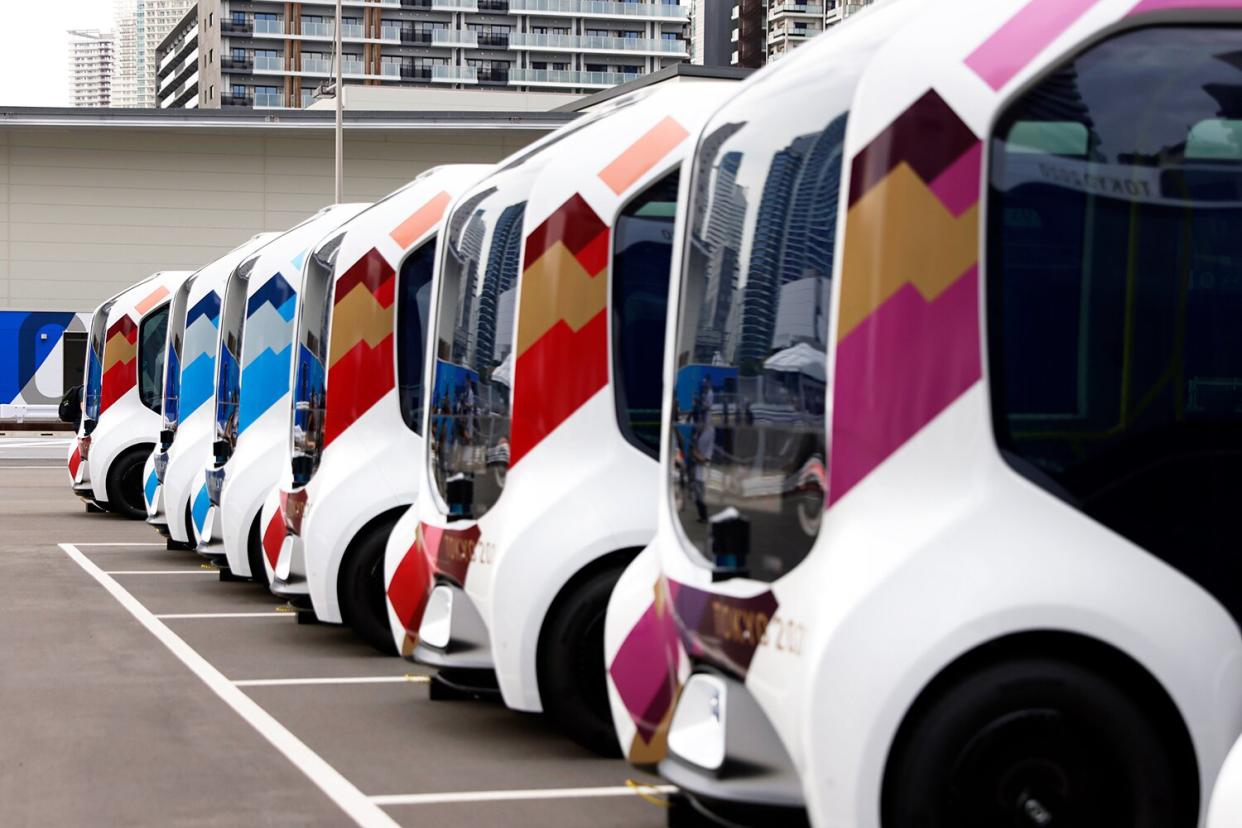 Toyota Motor Corp. e-Palette vehicles at the internal shuttle bus station during a media tour at the Olympic and Paralympic Village for the Tokyo 2020 Games, constructed in the Harumi waterfront district of Tokyo, Japan, on Sunday, June 20, 2021.