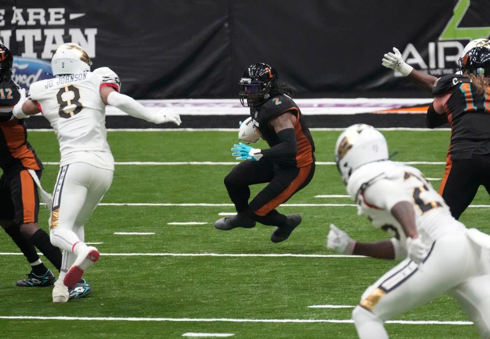 Arizona Rattlers wide receiver Jamal Miles (2) makes a cut in front of Vegas Knight Hawks defensive back Mister Harriel (8) at Desert Diamond Arena in Glendale on March 24, 2024.