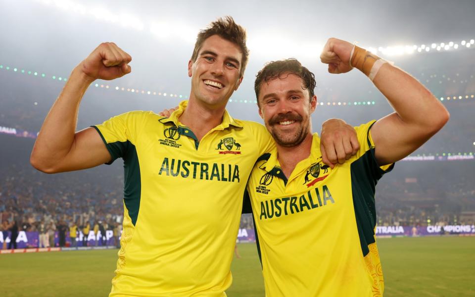 Captain Pat Cummins (l) with centurion Travis Head