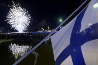 FILE PHOTO: Fireworks illuminate the sky to end the festivities of the centenary of Finnish independence in Helsinki, Finland on December 6, 2017 . LEHTIKUVA / Vesa Moilanen/ via REUTERS/File Photo