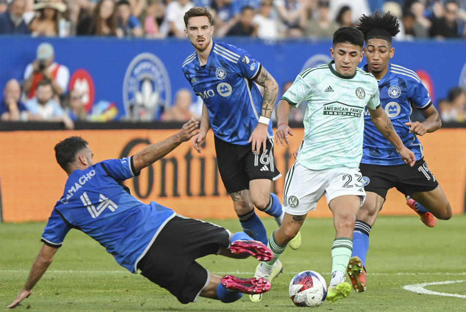 CF Montreal's Rudy Camacho (4) challenges Atlanta United's Thiago Almada (23) during the first half of an MLS soccer match Saturday, July 8, 2023, in Montreal. (Graham Hughes/The Canadian Press via AP)