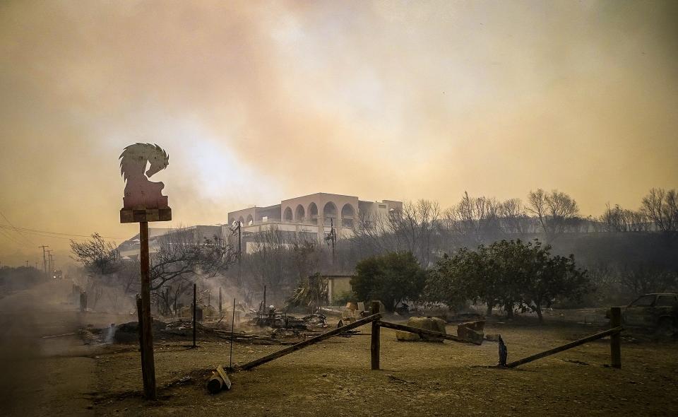 A burnt area is seen during a wildfire on the island of Rhodes (via REUTERS)