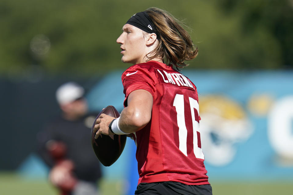 Jacksonville Jaguars quarterback Trevor Lawrence performs a drill during NFL football practice, Saturday, July 31, 2021, in Jacksonville, Fla. (AP Photo/John Raoux)