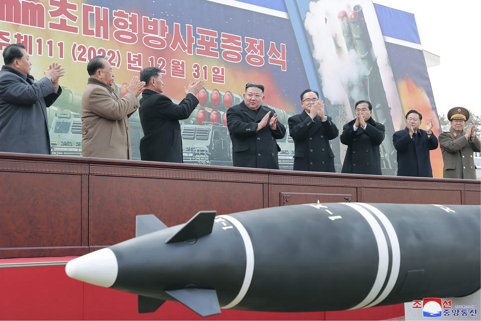 In this photo provided by the North Korean government, North Korean leader Kim Jong Un, center, attends a ceremony of donating 600mm super-large multiple launch rocket system at a garden of the Workers’ Party of Korea headquarters in Pyongyang, North Korea Saturday, Dec. 31, 2022. Independent journalists were not given access to cover the event depicted in this image distributed by the North Korean government. The content of this image is as provided and cannot be independently verified. Korean language watermark on image as provided by source reads: "KCNA" which is the abbreviation for Korean Central News Agency. (Korean Central News Agency/Korea News Service via AP)